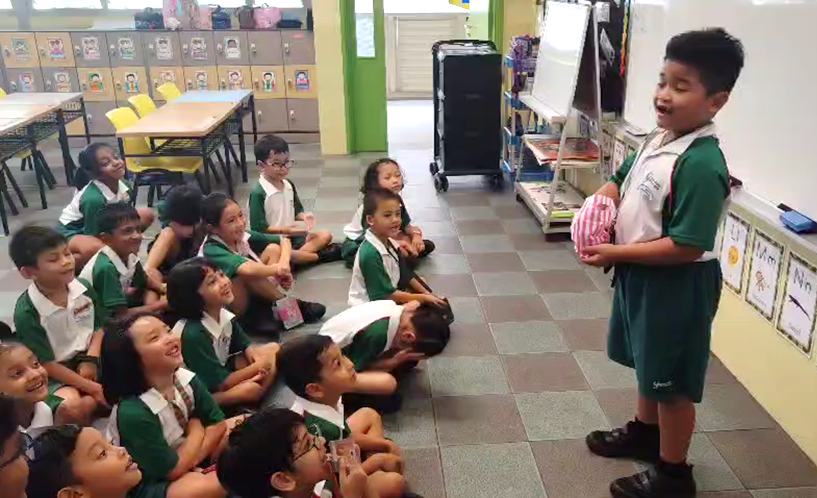Student presenting during a classroom show-and-tell activity.